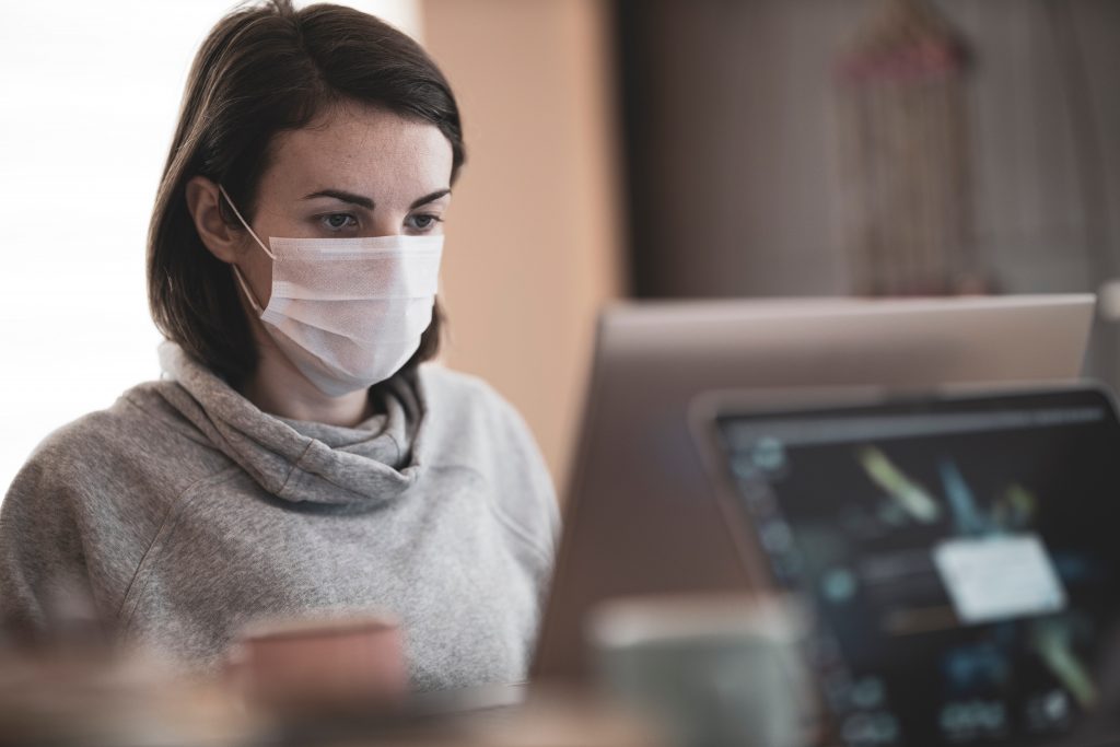 Woman wearing mask while at work