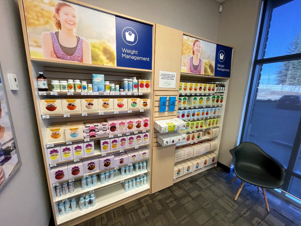 Shelves stocked with boxes of food and supplements