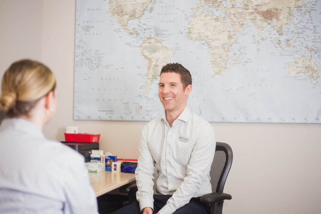 Pharmacist smiling at patient