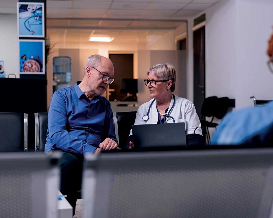 calgary pharmacist helping an elderly man