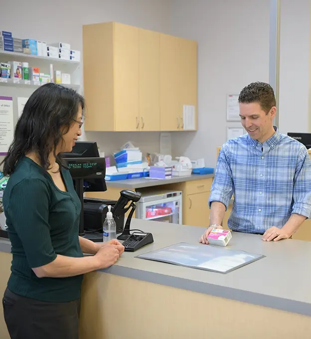 Pharmacist Randy Howden with a patient